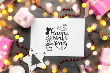 Beautiful  New Year greeting card, gifts and decor on dark background