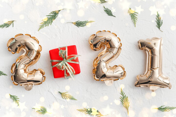 Beautiful New Year composition with figure 2021 on light background