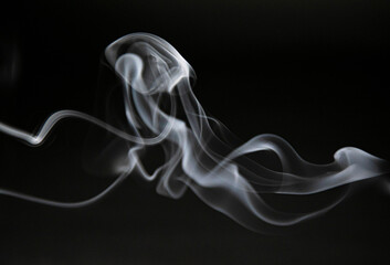 Smoke texture against black background.