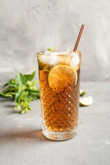 Glass of tasty Cuba Libre cocktail on table