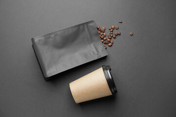 Blank coffee bag and cup on dark background