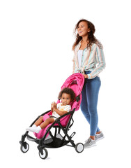 African-American woman and her cute baby in stroller on white background