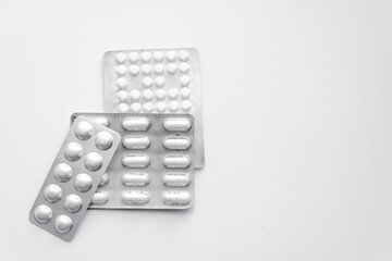 pack of pills lying on a white table