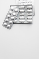 pack of pills lying on a white table