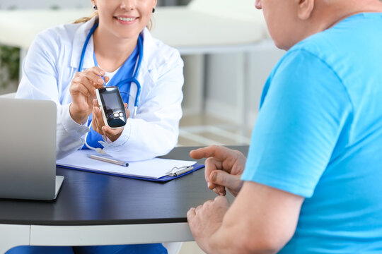 Senior diabetic man visiting doctor in clinic