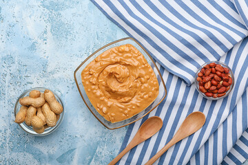 Composition with tasty peanut butter on table
