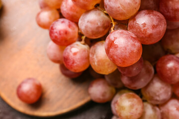 Sweet ripe grapes on table, closeup