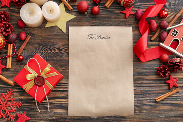 Letter to Santa and Christmas decor on wooden background