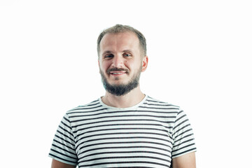 Obraz premium Smiling bearded mature man in a striped T-shirt. 30-35 years old. Isolated on white.