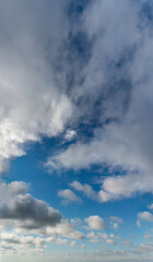 Fantastic clouds against blue sky, panorama