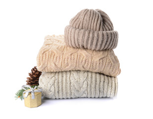 Stylish Christmas clothes on white background