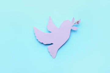 Paper dove on color background. International Day of Peace