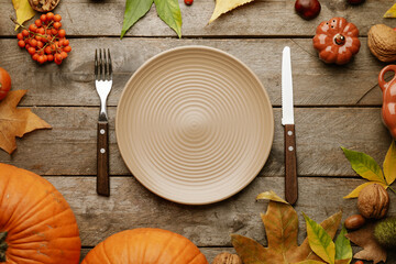 Beautiful table setting with autumn decor on wooden background