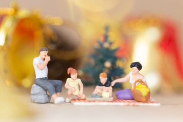 Miniature people, Happy family celebrating A Christmas  , Christmas and Happy New Year concept.