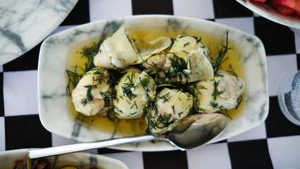 Baby artichoke starter dish with olive oil