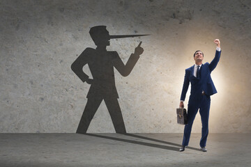 Fototapeta premium Concept of businessman liar with his shadow