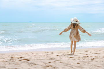 Traveler asian woman travel on beach in summer Thailand