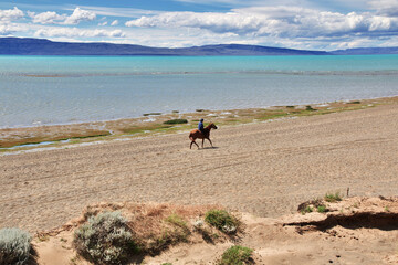 Fototapeta na wymiar Rider, Ranger in Laguna Nimez Reserva in El Calafate, Patagonia, Argentina