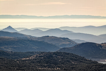 Fototapeta premium Panoramic of the Sierra de Avila, Skyline with fog at sunrise. Pico Cueva Valiente in Segovia and Madrid.