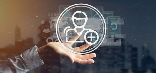 Businessman holding new contact icon