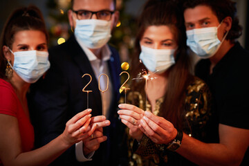 Two beautiful young couples having fun at New Year's Eve Party