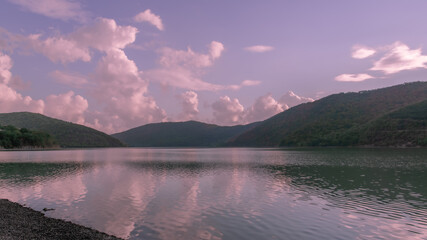 Pink sunset over a small lake