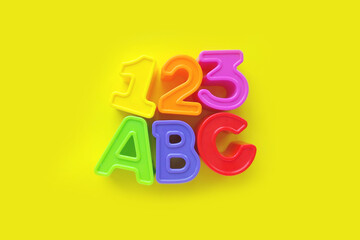 a b c letters and 1 2 3 numbers isolated on yellow background. banner, poster, brightly toy, learning