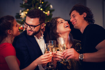 Two beautiful young couples having fun at New Year's Eve Party