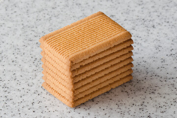 Rectangular shortbread cookies on a light marble top. Homemade baking.