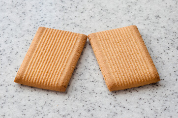 Rectangular shortbread cookies on a light marble top. Homemade baking.
