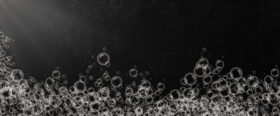 Soapy water bubble texture isolated on black background and slightly light. fizzy bubbles, gas or oxygen in the water. Realistic champagne drink, soap bubble effect.