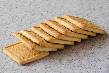 Rectangular shortbread cookies on a light marble top. Homemade baking.