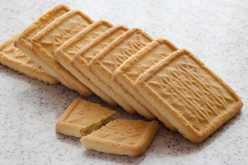 Rectangular shortbread cookies on a light marble top. Homemade baking.