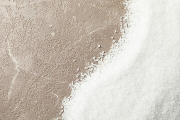 Sea salt on gray background, space for text