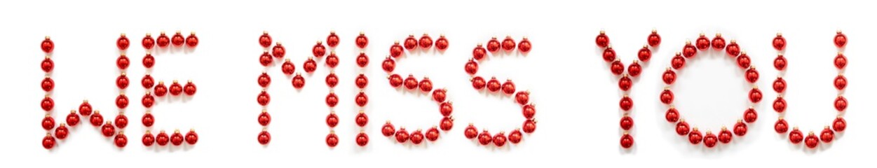 Red Christmas Ball Ornament Building English Word We Miss You. Festive Christmas Decoration. White Isolated Background