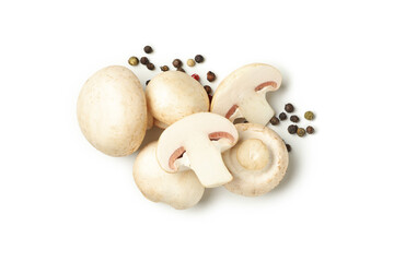 Raw mushrooms and peppercorns isolated on white background