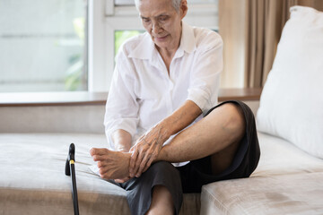 Old elderly with foot injuries,ankle bone diseases,heel pain or soles,asian senior woman suffering...