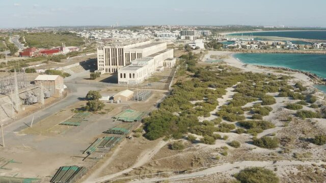Fremantle abandoned power station next to the beach. Aerial drone footage of australian beaches. Western australia