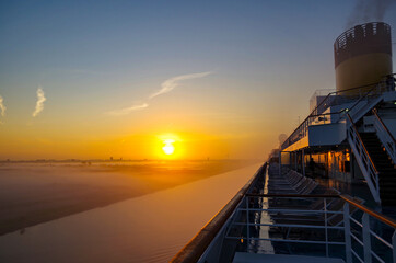 Fog on river bank or coast line seen from modern cruiseship or cruise ship liner on North Sea Canal...