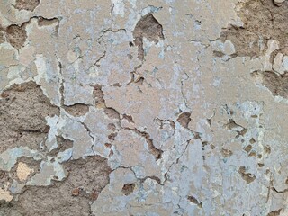 texture and background of old wall with falling plaster