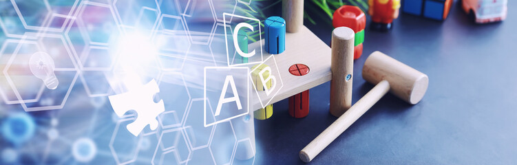Children's development. Children's wooden toy on the table in the play area. Room of children's creativity and self-development. Wooden constructor.