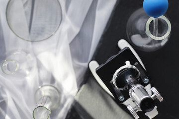 Laboratory research. Drug testing. Chemical experiments in the laboratory. Microscope various test tubes and beakers on the table at the medical officer.