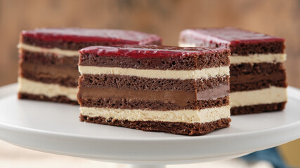 Classic french opera cake. Opera cake with raspberries. Chocolate cake.