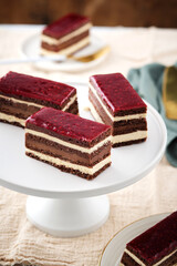 Classic french opera cake. Opera cake with raspberries. Chocolate cake.