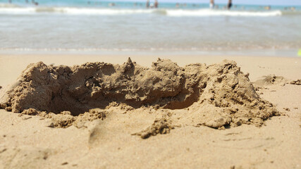 destructive wave castle on the sand by the sea