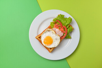 Close up of rustic savory egg waffle. Traditional breakfast idea. Egg toast for breakfast.