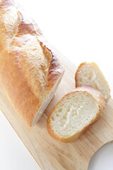 Loaf of French bread on wooden cutting board