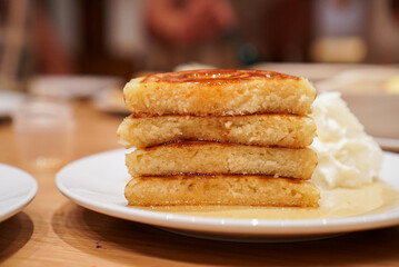 Cut in a half Pancake Stack. A fluffy pancake with maple syrup. (close up)