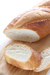 French bread, loaf on wooden board