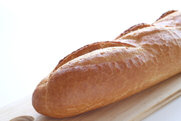 French bread, loaf on wooden board